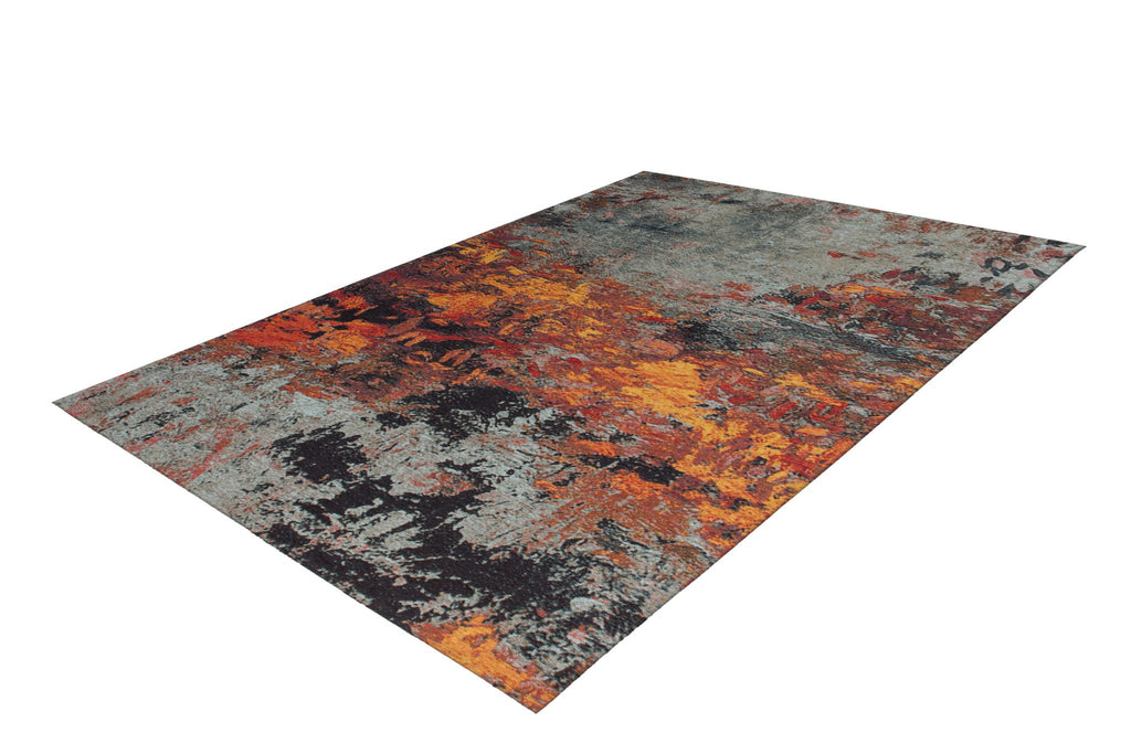 Ein rechteckiger Teppich in bunte Farben mit Abstract Mustern liegt im Wohnzimmer.