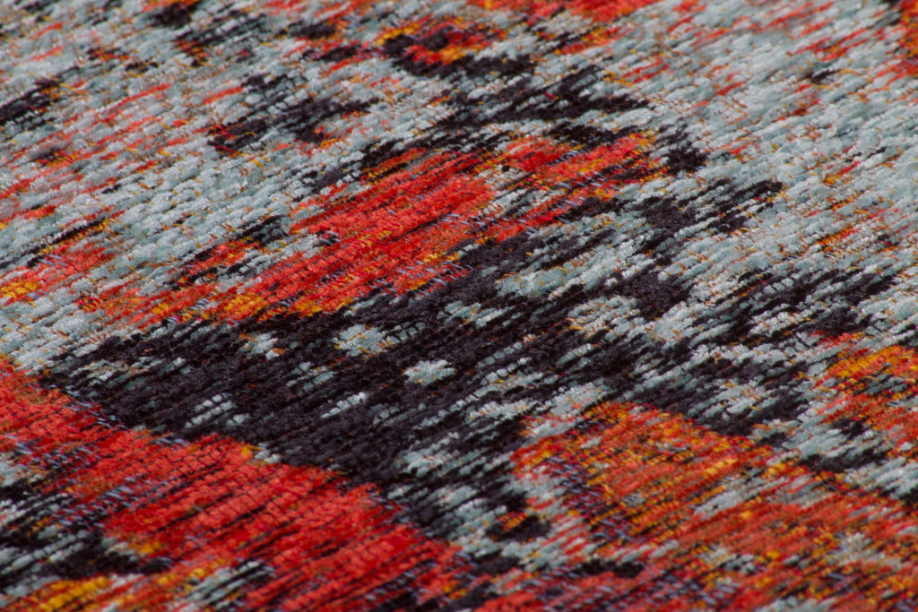 Ein rechteckiger Teppich in bunte Farben mit Abstract Mustern Nahaufnahme.